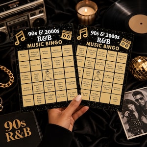 May include: Two rectangular 90s and 2000s R&B music bingo cards with a black background, gold musical note and boombox icons, and a grid of song titles and artists. The cards feature text reading 90s & 2000s R&B MUSIC BINGO in gold lettering.