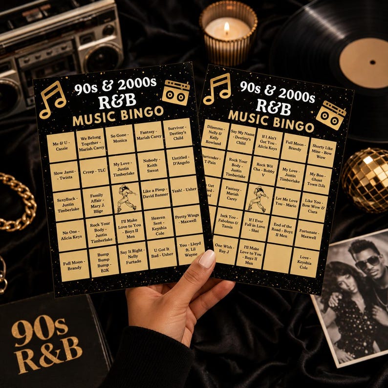May include: Two rectangular 90s and 2000s R&B music bingo cards with a black background, gold musical note and boombox icons, and a grid of song titles and artists. The cards feature text reading 90s & 2000s R&B MUSIC BINGO in gold lettering.