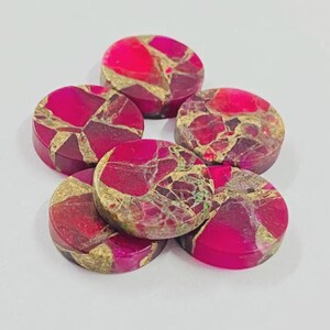 May include: Five circular cabochons featuring a vibrant magenta and hot pink base color with intricate, web-like gold veining patterns throughout the surface. Each piece has a smooth, flat top and a polished finish, displaying a cracked stone appearance.