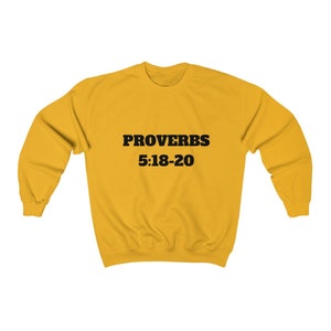 May include: A yellow sweatshirt with the text "PROVERBS 5:18-20" printed in black.