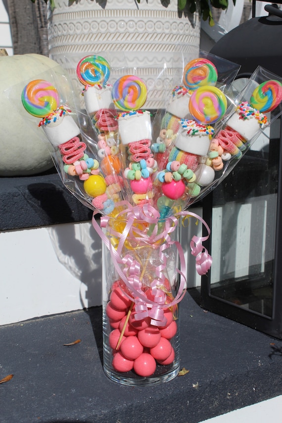 DIY candy bouquet. use wooden bbq skewers and large and small candy bars  taped together. buy a vase from the…