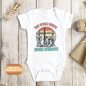 The world needs more cowboys Baby Onesie®, Cowboy baby Onesie®, Rodeo baby body suit. cute baby gift.