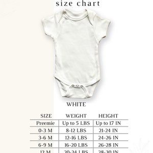 May include: A white Gerber baby onesie with a size chart. The chart lists sizes from preemie to 24 months, with corresponding weight and height measurements in pounds and inches. The onesie has short sleeves and snaps.
