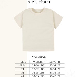 May include: Natural colored toddler t-shirt size chart with measurements in inches and pounds. The chart shows sizes 18M, 2T, 3T, 4T, and 5T with corresponding weight and length ranges.