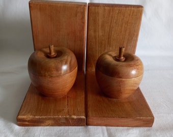 Vintage wooden bookends with apple storage pots.