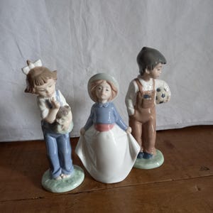 3 x Lladro, Nao figurines, nos.1290, 1068, 1069 perfect condition.