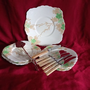 Vintage set, cake plates, cutlery and cake tongs.