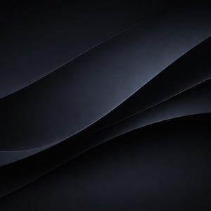 May include: A series of overlapping, smooth, dark charcoal gray curves that create a sense of depth and movement. The composition features layered, wave-like shapes with subtle gradients that transition from deep black to lighter gray tones.