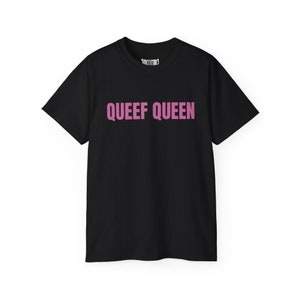 May include: Black t-shirt with the text "QUEEF QUEEN" printed in pink.