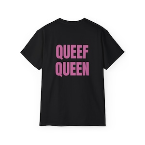 May include: Black t-shirt with the text "QUEEF QUEEN" printed in pink on the back.