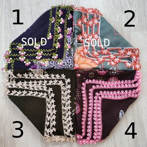 May include: Four crocheted squares with different colored borders and patterns. The squares are labeled 1, 2, 3, and 4.  The squares are all sold.