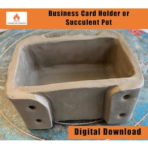 May include: A brown clay rectangular planter with rounded edges and two holes on each side. The planter is designed to hold small plants or business cards. Digital Download.