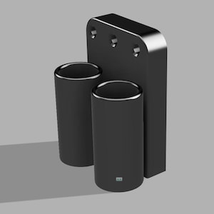 May include: Black wall-mounted holder with two cylindrical slots for storing items. The holder has three holes on the back for mounting.