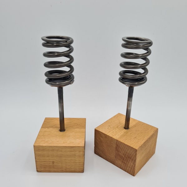 Upcycled candlestick holders, car engine valves and valvesprings set into a solidwood base. Handmade candle holder, fireplace centrepiece.