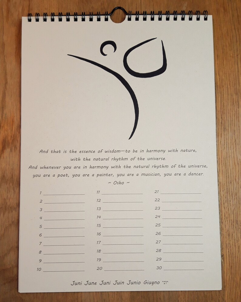 May include: A beige calendar with a black spiral binding. The calendar features a black and white drawing of a person dancing. The text "And that is the essence of wisdom to be in harmony with nature, with the natural rhythm of the universe. And whenever you are in harmony with the natural rhythm of the universe, you are a poet, you are a painter, you are a musician, you are a dancer. ~ Osho ~" is printed on the calendar. The numbers 1 through 30 are listed in three columns.