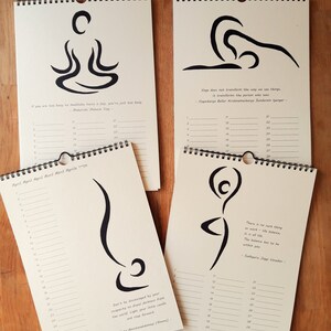 May include: Four beige calendar pages with black ink illustrations of yoga poses. Each page features a different pose and a quote about yoga. The months are April and October.
