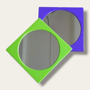 1970's Flat Space Age Wall Mirror | In purple and poisonous green | New from old stock | Retro mirror from the seventies