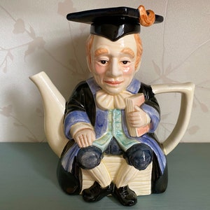 Ceramische nieuwigheid theepot afstudeerleraar