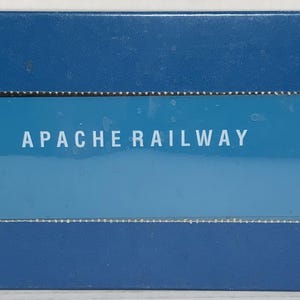 May include: A blue box with a white label that reads "APACHE RAILWAY" and "APA 1311".