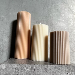 Ribbed pillar candle | shaped | decorative | wedding | striped | customisable | decor | aesthetic | navy orange green white | home