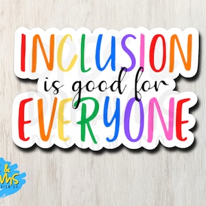 May include: A sticker with the text "Inclusion is good for everyone" in rainbow colors. The sticker is on a wood background.