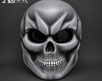 May include: A silver-toned skull mask featuring deep-set black eye sockets, a prominent nasal cavity, and a detailed row of teeth. The surface displays subtle shading and cracks. The text XBow with an arrow icon is visible in the top left corner.