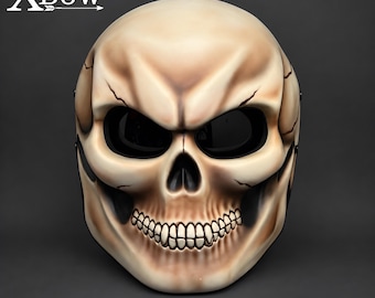 May include: A full-face skull mask featuring a beige and off-white bone-colored finish with dark shading in the eye sockets and nasal cavity. The mask displays the text XBow in the upper left corner and has black mesh over the eye openings.