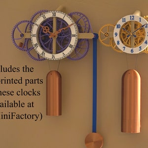 May include: Two intricate clock mechanisms with gears and pendulums. The clock faces are white with Roman numerals and blue hands. The clock on the left has purple gears and the clock on the right has gold gears. The text "Includes the non-printed parts for these clocks (available at MyMiniFactory)" is visible below the clocks.