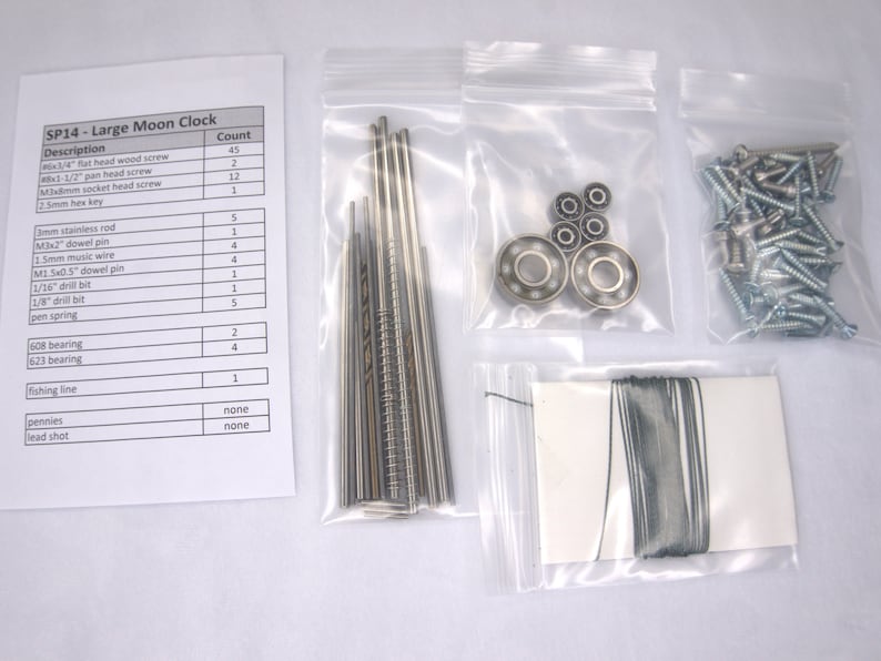 May include: A list of parts and their quantities for a large moon clock kit. The parts are organized in a table with the description and count of each part. The parts are packaged in small plastic bags.