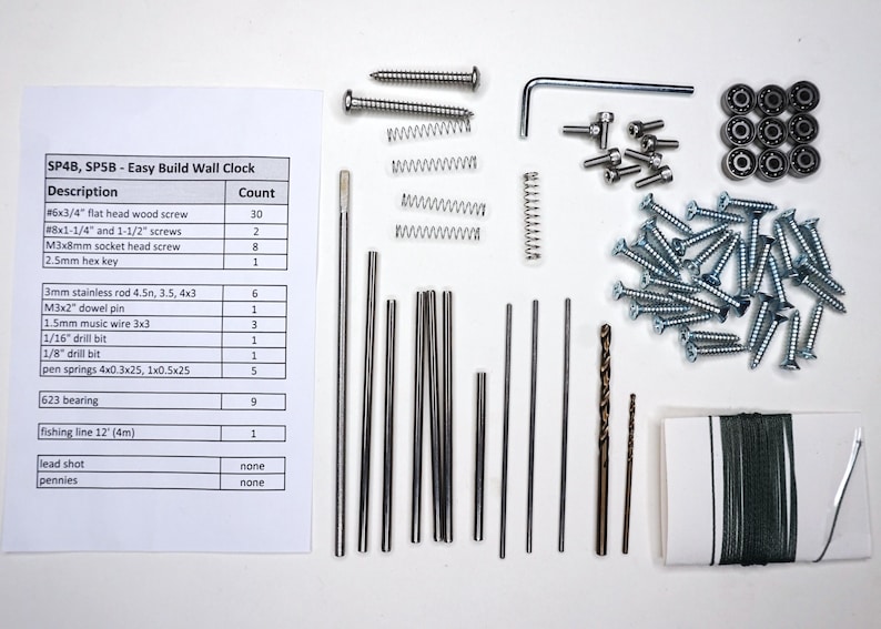 May include: A parts kit for building a wall clock. The kit includes screws, dowel pins, drill bits, springs, a hex key, a bearing, and fishing line. The kit also includes a list of parts and their quantities.