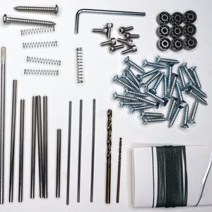 May include: Assortment of hardware supplies including screws, springs, metal rods, drill bits, bearings, and a spool of string.