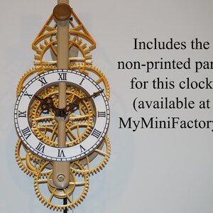 May include: A gold-colored clock with Roman numeral markings on a white face. The clock has a complex gear system and a wooden pendulum. The text "Includes the non-printed parts for this clock (available at MyMiniFactory)" is visible in the image.