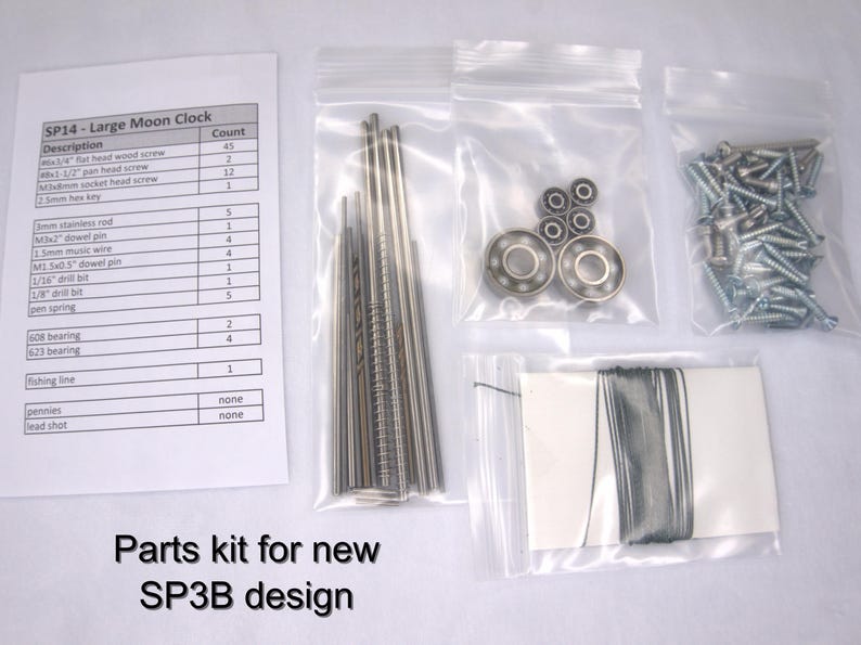 May include: A parts kit for a large moon clock, with a list of parts and their quantities. The kit includes screws, dowel pins, a spring, bearings, fishing line, and other small parts. The parts are organized in small plastic bags.
