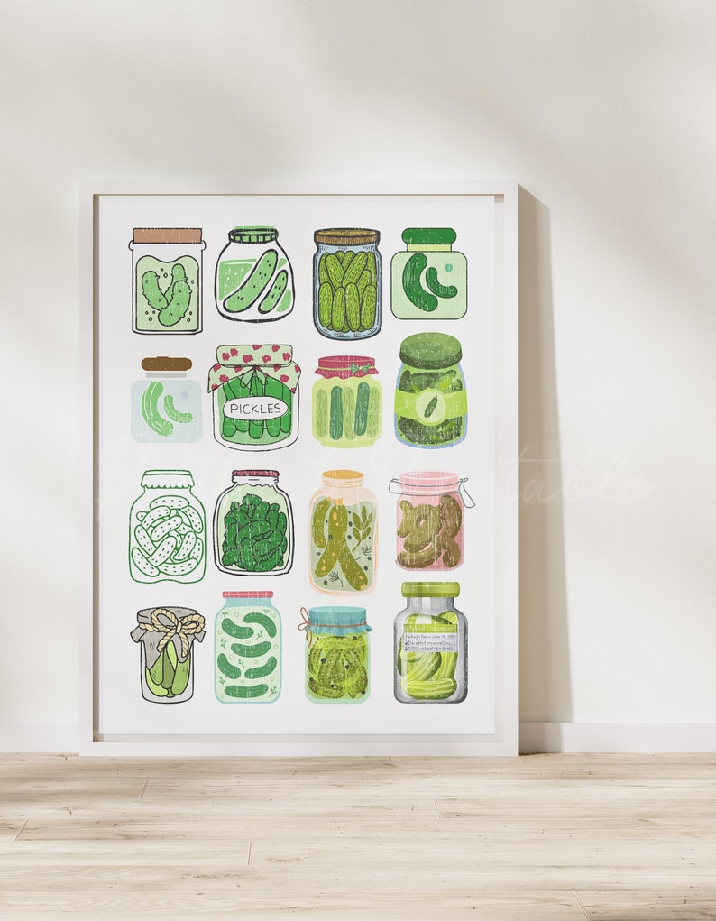 May include: A white framed print with a colorful illustration of 15 jars of pickles. The jars are filled with green pickles and have different colored lids and labels. The word "PICKLES" is written on one of the labels.
