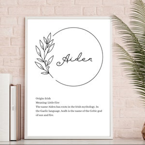 May include: A white framed wall art print featuring the name Aiden in black script inside a circular line drawing with a leafy branch. Below the name, black text reads: Origin: Irish, Meaning: Little Fire, The name Aiden has roots in the Irish mythology. In the Gaelic language, Aodh is the name of the Celtic god of sun and fire.