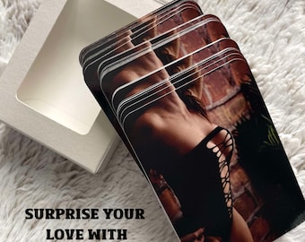 May include: A stack of personalized spicy selfie playing cards with a woman in a black outfit, presented in a white box. The cards feature a photo of a woman in a black outfit. The word "Hot" is in a red burst.