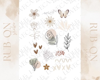 May include: A sheet of rub-on stickers featuring various botanical and abstract designs. The stickers include flowers, leaves, hearts, a butterfly, and wavy lines in shades of brown, beige, and black. The words "RUB-ON Sticker" are printed on the sheet.