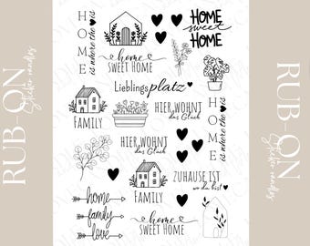 May include: A collection of black and white home decor stickers with various designs. The stickers include house illustrations, hearts, floral elements, and phrases like "Home Sweet Home" and "Family".
