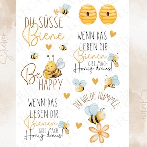 Könnte beinhalten: Ein Bogen mit Aufreibebildern, der Aquarellillustrationen von Bienen, Bienenstöcken, Blumen und Herzen zeigt. Der Text enthält Phrasen wie Du süsse Biene, Be Happy, Wenn das Leben dir Bienen gibt, mach Honig draus und Du wilde Hummel in Schreibschrift.