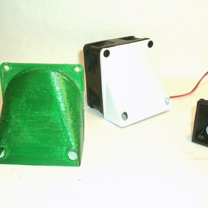 May include: An assortment of 3D-printed electronic components in red, green, black, and white. The components include angled housings and a small display screen. Some have mounting holes and wires.