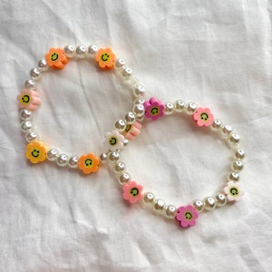 Black Clay Beaded Bracelet with Black and Gold Happy Face Charm