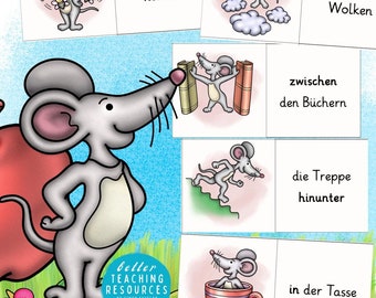 Op de afbeelding: Een set kleurrijke flashcards met een cartoonmuis in verschillende posities. De kaarten illustreren Duitse voorzetsels zoals "um", "über", "zwischen", "die Treppe" en "in der Tasse".