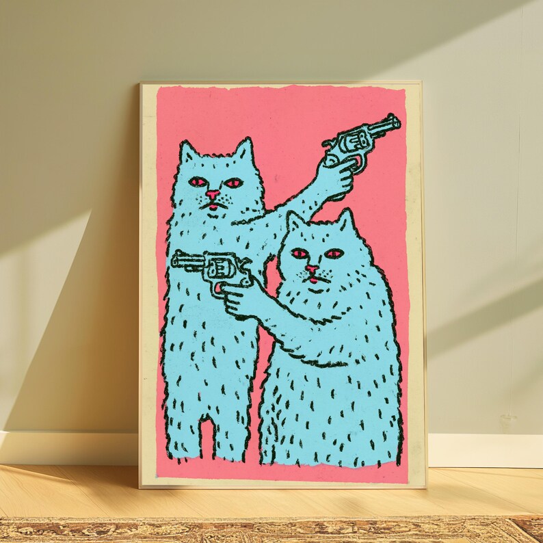 May include: A rectangular art print featuring two light blue cats with red eyes against a solid pink background. Each cat is holding a black revolver, with one cat pointing its weapon upward and the other pointing its weapon forward in a graphic style.