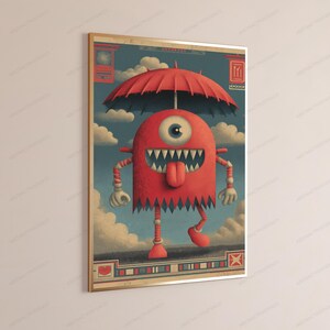 May include: A framed wall art print featuring a red, one-eyed monster with sharp teeth and a protruding tongue, standing under a large red umbrella against a blue sky with clouds. The artwork includes decorative borders with geometric patterns.