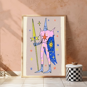 May include: A framed art print featuring a stylised figure in a pink suit with a tall pointed headpiece, holding a long yellow spear and a blue shield. The background is light beige with scattered colourful stars and small circular shapes.