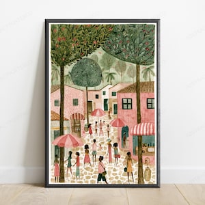 May include: A framed art print depicting a bustling town square with pink buildings, cobblestone streets, and tall green trees. Numerous figures walk through the scene, some carrying pink and white striped umbrellas under a soft, light-filled sky.
