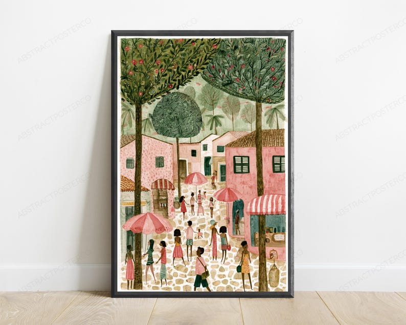 May include: A framed art print depicting a bustling town square with pink buildings, cobblestone streets, and tall green trees. Numerous figures walk through the scene, some carrying pink and white striped umbrellas under a soft, light-filled sky.