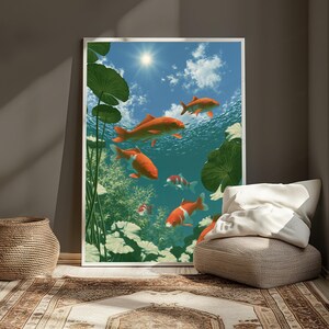 May include: A framed wall art print depicting a vibrant underwater scene with several orange and white koi fish swimming among green lily pads. The water is clear, revealing a bright blue sky with a shining sun and white clouds above the surface.