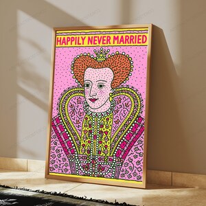May include: A framed vertical poster featuring a stylized illustration of a royal figure with a crown and elaborate collar. The background is pink with black dots. The text "HAPPILY NEVER MARRIED" is printed in yellow at the top of the artwork.