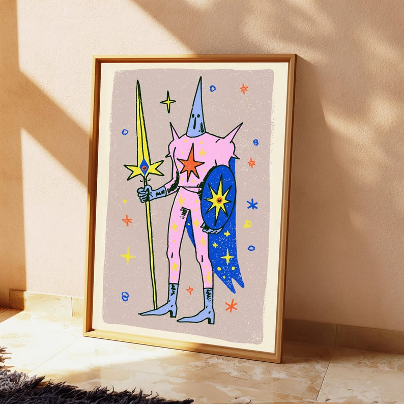 May include: A framed art print featuring a stylised figure in a pink suit with a pointed hood, holding a tall yellow spear and a blue shield. The figure is surrounded by colourful star icons against a textured light purple background.